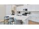 Stylish kitchen showcasing a large island, white cabinets, and modern appliances at 9253 Players Dr, Weeki Wachee, FL 34613
