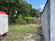 Spacious backyard with a shed and wooden fence, offering an outdoor area at 1009 Kenmore Dr, Brandon, FL 33510