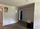Open living room with tile floors, and bright lighting, providing a cozy and spacious living area at 1009 Kenmore Dr, Brandon, FL 33510