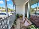 Cozy screened balcony with comfortable seating and scenic outdoor views, perfect for relaxation at 2700 Coconut Bay Ln # 419, Sarasota, FL 34237