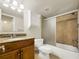 Bathroom with updated vanity, granite countertop, and tiled shower/tub combination at 2700 Coconut Bay Ln # 419, Sarasota, FL 34237