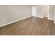 Comfortable bedroom with laminate floors, a closet, and a door, providing a private retreat at 2700 Coconut Bay Ln # 419, Sarasota, FL 34237