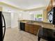 Updated kitchen with granite countertops, stainless appliances, and an eat-in bar at 2700 Coconut Bay Ln # 419, Sarasota, FL 34237