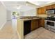 Well-equipped kitchen featuring stainless steel appliances, granite countertops, and ample cabinetry at 2700 Coconut Bay Ln # 419, Sarasota, FL 34237