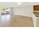 Spacious living room with tile flooring and access to the balcony with natural light at 2700 Coconut Bay Ln # 419, Sarasota, FL 34237