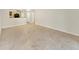 Open floor plan of the living room featuring tile floors and a view into the kitchen at 2700 Coconut Bay Ln # 419, Sarasota, FL 34237