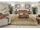 Beautiful lobby with seating, plants, neutral walls, and stairway to the upper level at 2700 Coconut Bay Ln # 419, Sarasota, FL 34237