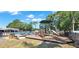 Community playground with slides, climbing structures, and seating near the pool at 2700 Coconut Bay Ln # 419, Sarasota, FL 34237