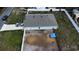 Aerial view of a home with a fenced backyard, featuring ample space and a well-maintained exterior at 6315 Hillview Rd, Spring Hill, FL 34606