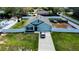 Aerial view of a light blue single-Gathering home with a large, partially fenced backyard at 6315 Hillview Rd, Spring Hill, FL 34606