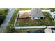 Aerial view of the house featuring a large fenced yard with partially cleared space at 6315 Hillview Rd, Spring Hill, FL 34606