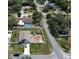 Aerial view showcasing a house with a spacious, partially fenced lot in a residential neighborhood at 6315 Hillview Rd, Spring Hill, FL 34606