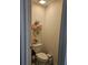 Powder room features a toilet and decorative shelves at 6315 Hillview Rd, Spring Hill, FL 34606
