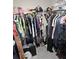 Walk-in closet is fitted with hanging clothing rods and storage at 6315 Hillview Rd, Spring Hill, FL 34606