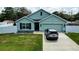 Charming single-story home with a two-car garage, manicured lawn, and tasteful landscaping at 6315 Hillview Rd, Spring Hill, FL 34606