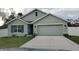 Charming single-story home with a two-car garage, neat landscaping, and a well-maintained front lawn at 6315 Hillview Rd, Spring Hill, FL 34606