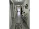 Inviting hallway with a decorative table and a view leading into the living area at 6315 Hillview Rd, Spring Hill, FL 34606