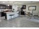 Kitchen featuring dark cabinets, a large island with seating, stainless steel appliances, and chandelier lighting at 6315 Hillview Rd, Spring Hill, FL 34606