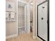 Well-lit bathroom showcasing a shower, a closet, and neutral color palette at 9005 Players Dr, Weeki Wachee, FL 34613