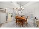 Dining area featuring an adjacent kitchen and ample natural light from the window at 1103 Kensington Ct, Safety Harbor, FL 34695
