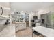 Renovated kitchen featuring stainless steel appliances, white cabinets, and modern fixtures at 1103 Kensington Ct, Safety Harbor, FL 34695