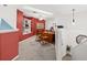Bright, functional office space with built-in shelving and carpeted flooring, perfect for working from home at 1103 Kensington Ct, Safety Harbor, FL 34695