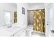 Modern bathroom featuring tile, a shower, and a white sink and cabinet at 11330 Burgundy Dr, Venice, FL 34293