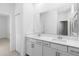 Modern bathroom featuring a double sink vanity with pristine white cabinets at 11330 Burgundy Dr, Venice, FL 34293