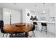 Bright dining room with a wooden table and bar seating in the modern, updated kitchen at 11330 Burgundy Dr, Venice, FL 34293