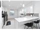 Well-lit kitchen with a quartz countertop island, stainless steel appliances, and modern cabinetry at 11330 Burgundy Dr, Venice, FL 34293