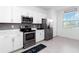 Bright kitchen featuring stainless steel appliances, white cabinets and countertop space at 11330 Burgundy Dr, Venice, FL 34293