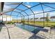 Screened pool area offers a serene view, complete with a spa and beautiful backyard landscaping at 11330 Burgundy Dr, Venice, FL 34293