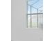 Sunlit view of a window with blinds partially closed at 11330 Burgundy Dr, Venice, FL 34293