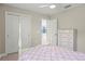 Charming bedroom with a decorative bed frame, a full closet, and access to an ensuite bathroom at 6288 Winding Pine Dr, Nokomis, FL 34275