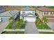 Charming two-story home with landscaped yard and paver driveway, perfect for curb appeal at 6288 Winding Pine Dr, Nokomis, FL 34275