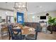 Open-concept living space features a kitchen with breakfast bar flowing into a comfortable living area with modern decor at 6288 Winding Pine Dr, Nokomis, FL 34275