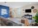 Bright living room with coastal accents, comfortable seating, and a staircase leading to the upper level at 6288 Winding Pine Dr, Nokomis, FL 34275