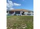 Spacious backyard featuring a patio and a well-maintained lawn at 12322 Alta Mira St, North Port, FL 34287
