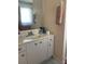 Bathroom vanity with a light countertop and a mirror at 12322 Alta Mira St, North Port, FL 34287