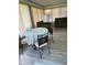 Bright dining area featuring a round table with seating and soft natural light, perfect for intimate meals at 12322 Alta Mira St, North Port, FL 34287