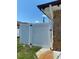 A view of a white fence, adding privacy to the property at 12322 Alta Mira St, North Port, FL 34287