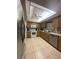 Functional kitchen featuring tile floors, wooden cabinets, and modern appliances at 12322 Alta Mira St, North Port, FL 34287