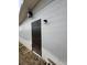 Side view of back door with brick exterior, with exterior lighting at 147 Melanie Ln, Brandon, FL 33510