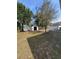 Spacious backyard featuring a white fence and storage shed at 147 Melanie Ln, Brandon, FL 33510