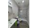 Bathroom featuring walk-in shower with decorative wall tile and a modern sink at 147 Melanie Ln, Brandon, FL 33510