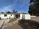 Charming single-story home featuring a well-maintained front yard and cozy entrance at 147 Melanie Ln, Brandon, FL 33510
