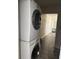 Efficient laundry area featuring a stacked washer and dryer set at 147 Melanie Ln, Brandon, FL 33510