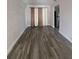 An open living area showcasing modern hardwood flooring and natural lighting at 147 Melanie Ln, Brandon, FL 33510