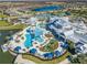 Aerial view of the Del Webb community showcasing a large pool, clubhouse, and recreation areas at 19165 Iron Topsail Isle, Land O Lakes, FL 34638