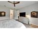 Spacious bedroom with en-suite access, wood-look floors, and modern decor, ideal for relaxation at 19165 Iron Topsail Isle, Land O Lakes, FL 34638